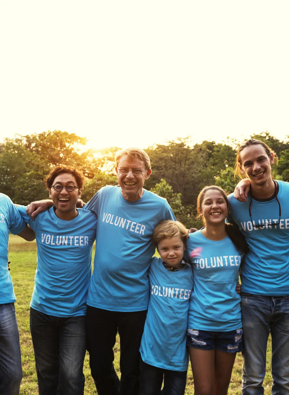 group of all ages wearing volunteer shirts